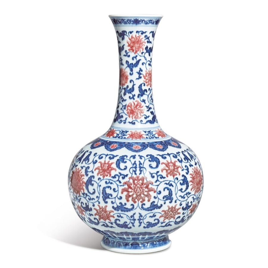A fine and exceptionally rare underglaze-blue  and copper-red ‘lotus’ bottle vase, Qianlong seal mark and period (1736-1795). Image © Sotheby’s 