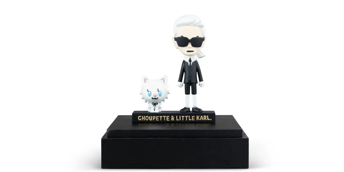 Figures of Karl Lagerfeld and Choupette under plexiglass. Photo © Sotheby's