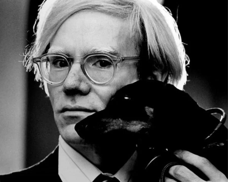 Jack Mitchell, photo portrait of Andy Warhol with dachshund Archie, 1973. Photo via Wikimedia Commons (License CC BY-SA 4.0)