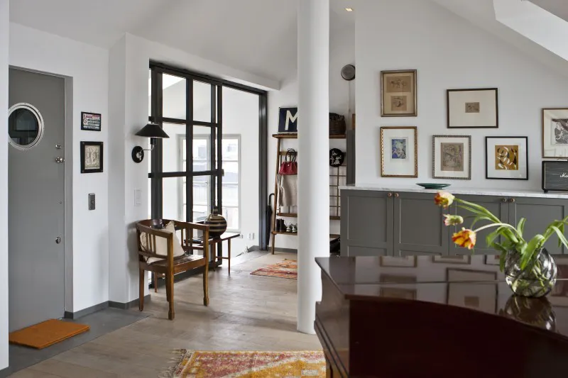 The owners, Eva and Lars decorated their new home with Scandinavian vintage furniture and colourful textiles to create a harmonious space. Photo © Kent Billeqvist