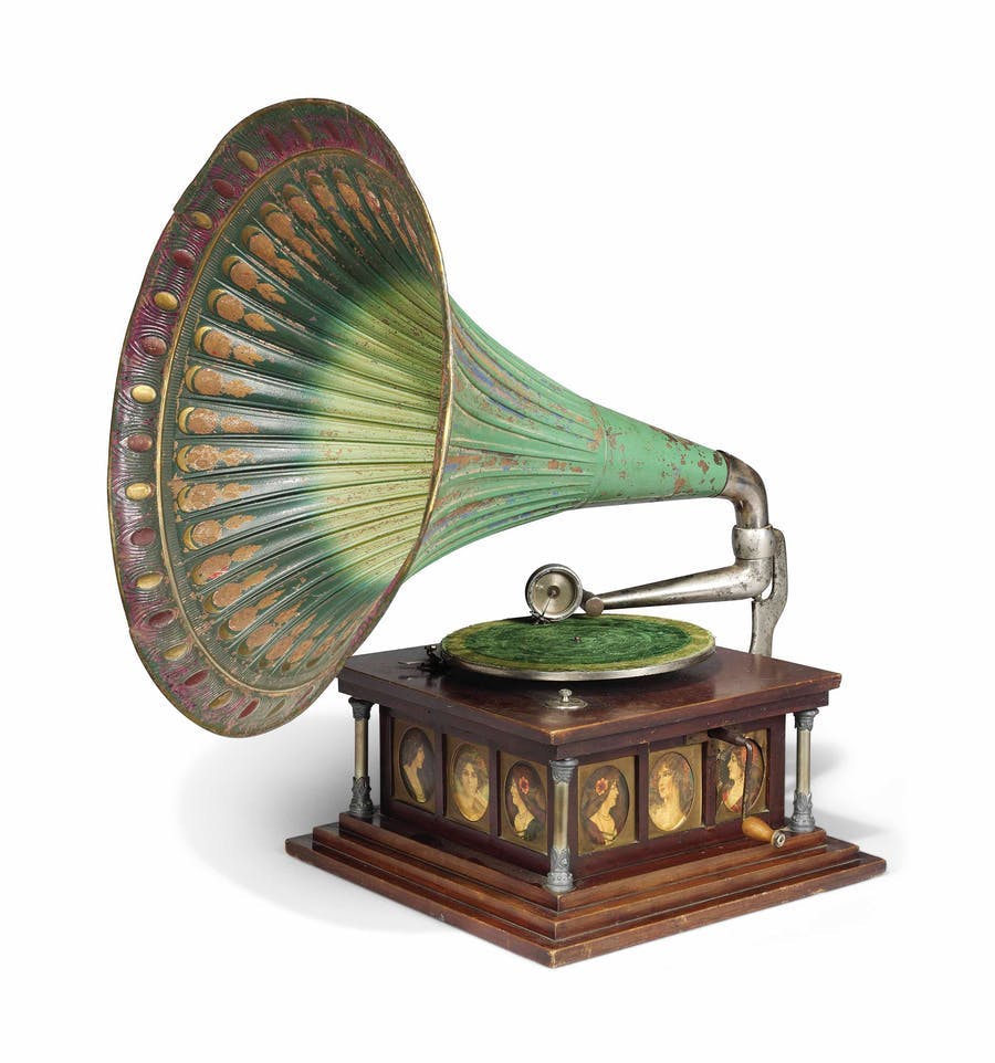 Hand-cranked gramophone in a stained beech box with porcelain plates representing historical figures, c. 1920, sold at Christie's for €5,396 in 2018. Image © Christie's
