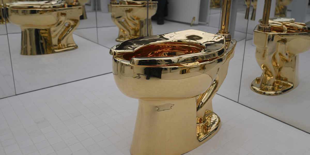 NEW YORK, USA – NOVEMBER 17: Maurizio Cattelan's influential artwork, a solid gold toilet titled “America” (2016), will be exhibited at Sotheby's Breuer Building in New York City, USA, on November 17, 2025. (Photo: Selcuk Acar/Anadolu via Getty Images) (detail)