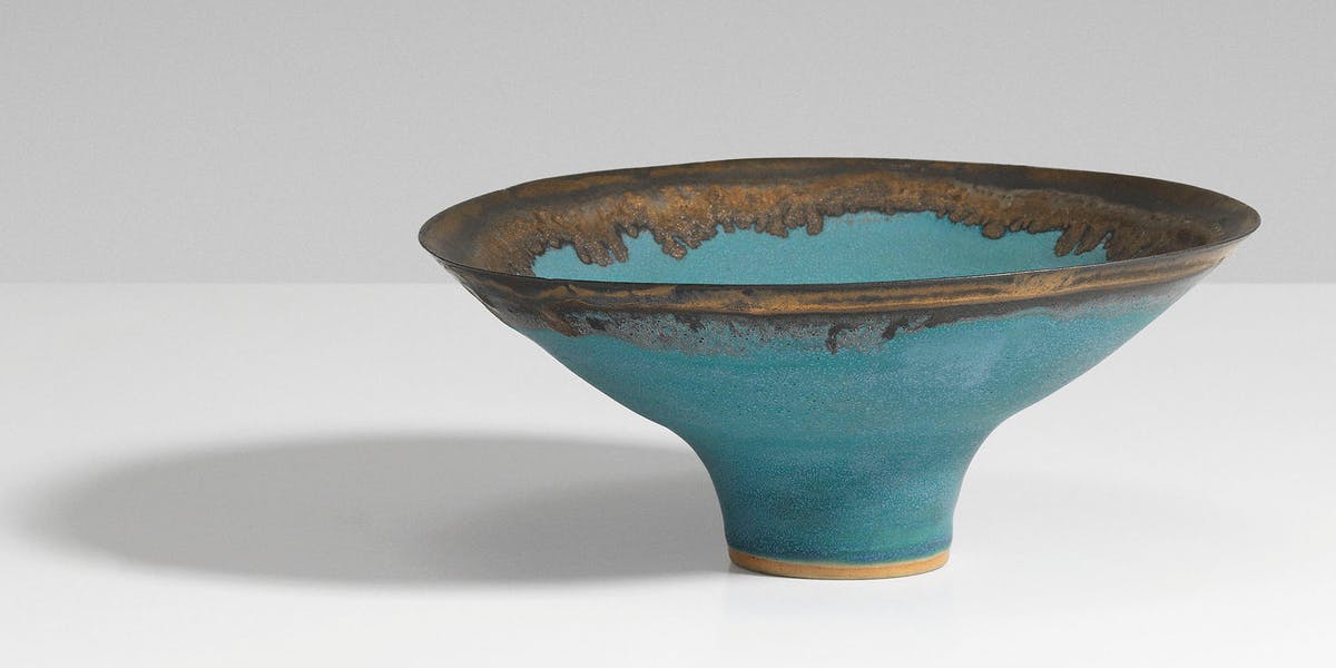 Lucie Rie (1902-1995), ‘A Bowl’, c. 1986, stoneware with blue glaze and manganese rim, 7.3 x 17 cm. diameter. Image via Christie’s