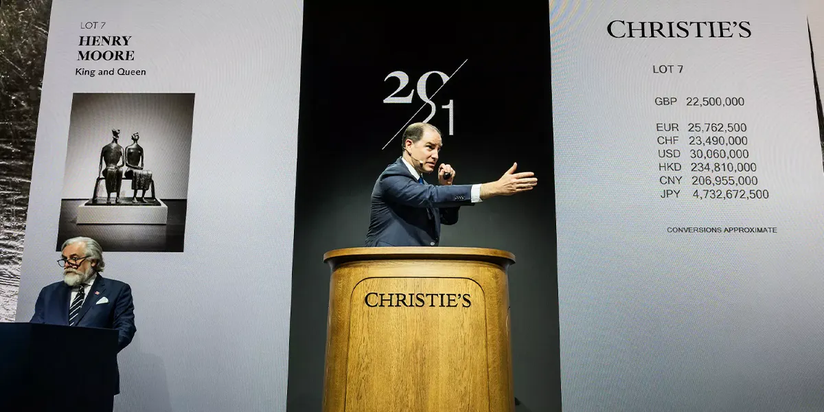 Adrien Meyer, global head of private sales and co-chairman for Impressionist and Modern Art, sells Henry Moore's "King and Queen" at Christie's new podium, redesigned by Sir Jony Ive and his team at LoveFrom. Photo © Christie's (detail)
