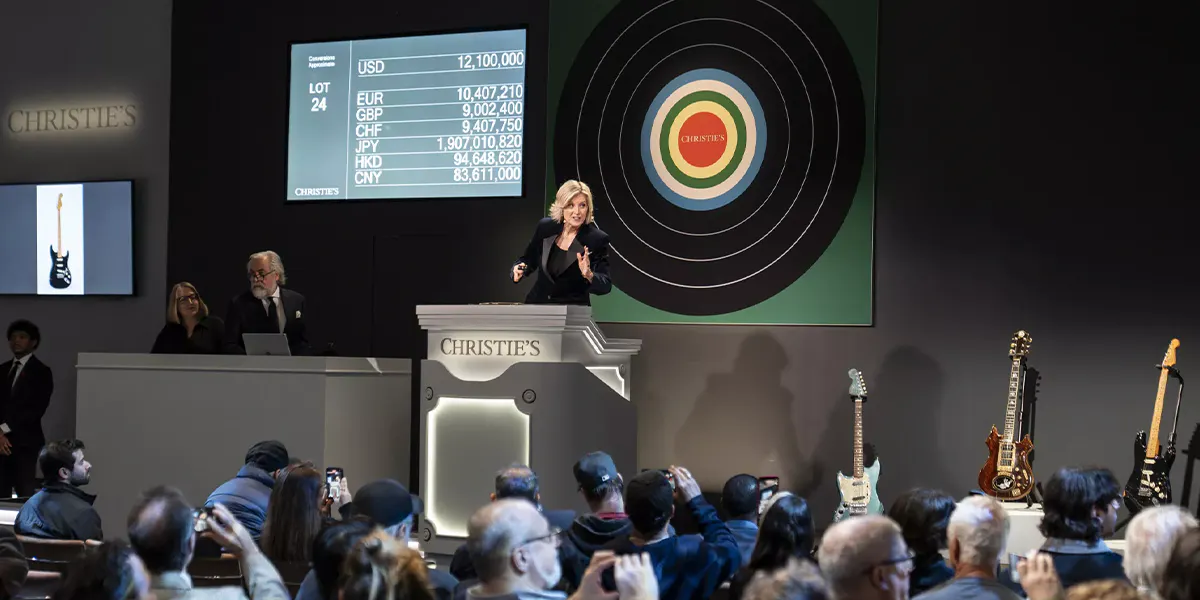 Auctioneer and vice chairwoman Tash Perrin sells the most expensive instrument ever auctioned, David Gilmour's "Black Strat," for $14,550,000 (including buyer's premium) after 21 minutes. Photo © Christie's (detail)