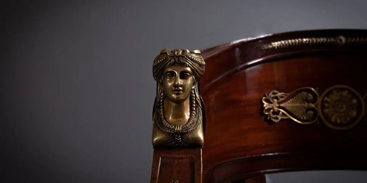 A fine Empire mahogany and ormolu mounted library chair, 19th Century, French, 80 x 66 cm (detail). Image © DeVeres