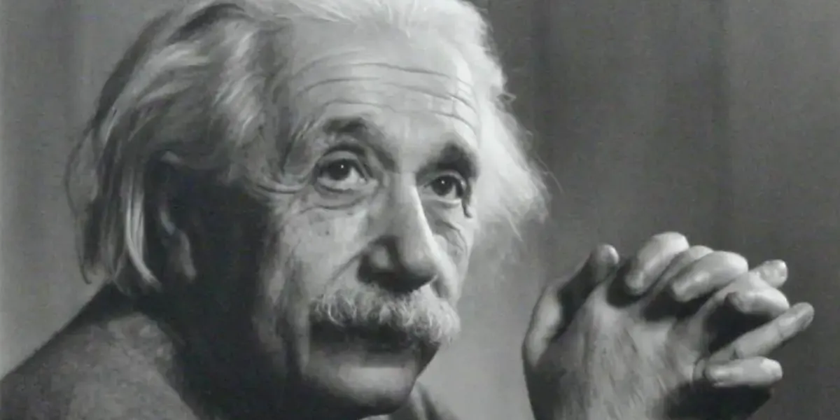 Portrait Photograph of Albert Einstein, signed by Yousuf Karsh. Silver print. Photo taken Princeton, 1948. Printed later. Signed by Karsh in full beneath the image on photographer’s mount. With Karsh’s original calling “card” – a 4x10 inch cardboard slip – included. Image: 8x9 inches. Framed to an overall size of 12x15 inches. Image © Manhattan Rare Books (detail)