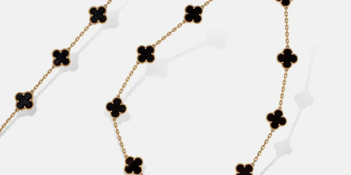 Van Cleef & Arpels, ‘Alhambra’ half-set in 18K (750) yellow gold and onyx comprising a bracelet and a necklace. Photo © Rossini