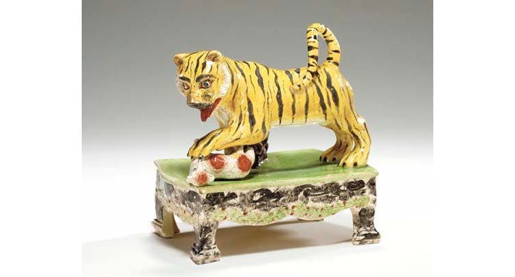 Tiger and the lamb, Staffordshire pottery from 1830, sold for £3,970 in 2003. © Christies