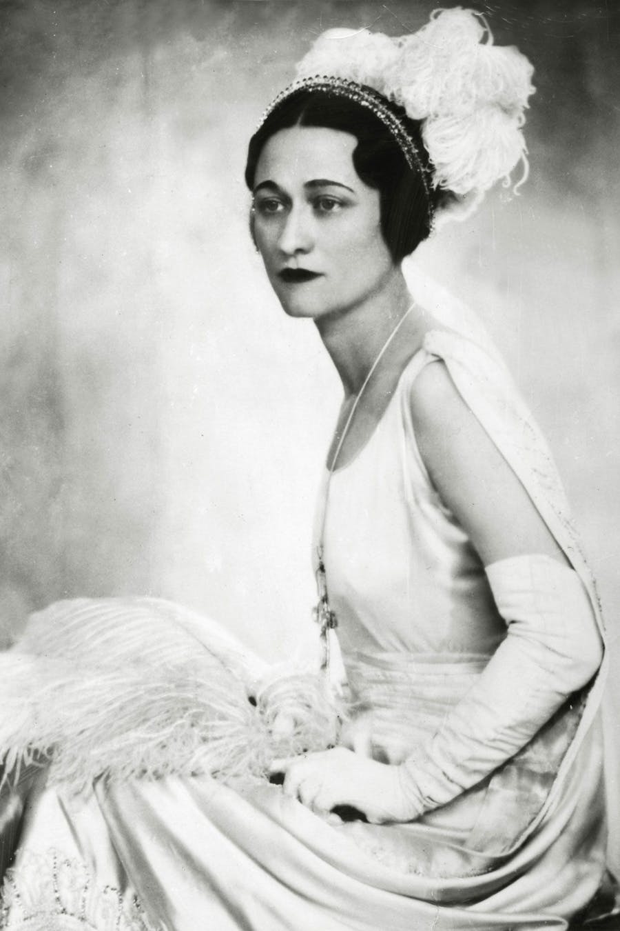 Portrait of Wallis Simpson taken in the gown she wore when presented at court, 1930s. Photo public domain
