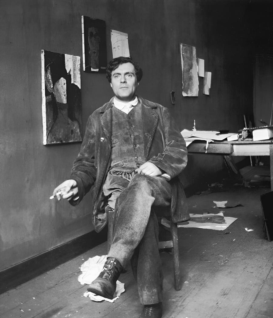 Amedeo Modigliani (1884–1920) in his studio in Paris. Public domain image