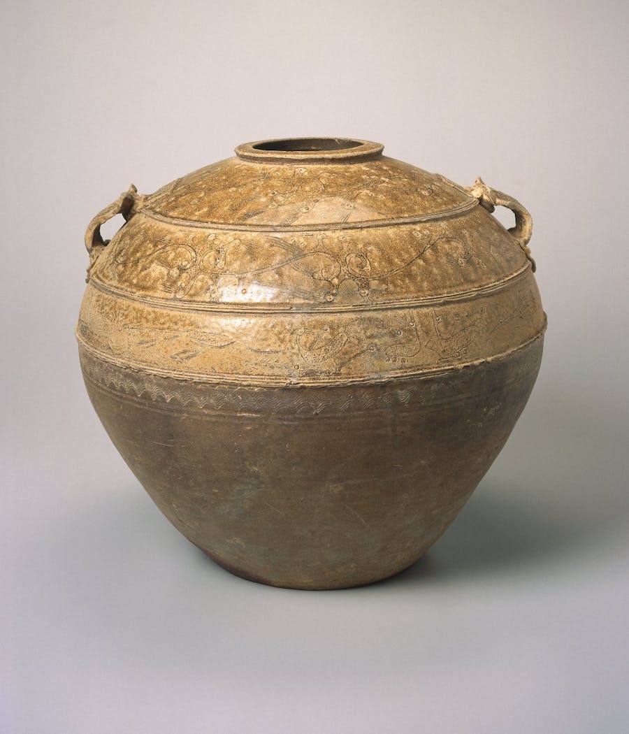 Storage Jar, 206 B.C.E.-220 C.E. Proto-Yue ware, stoneware with natural ash glaze, 13 1/4 x 15 3/8 in. (33.7 x 39.1 cm). Brooklyn Museum, Gift of Dr. and Mrs. George J. Fan, 1996.26.1. Creative Commons-BY (Photo: Brooklyn Museum, 1996.26.1_SL1.jpg)