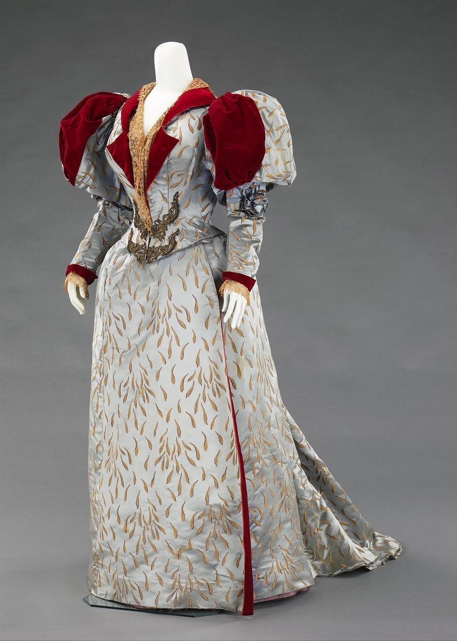 Evening dress made of silk, linen and metal from House of Worth, 1893. Public domain image via Brooklyn Museum Costume Collection at The Metropolitan Museum of Art, Gift of the Brooklyn Museum, 2009; Gift of Edith Gardiner, 1926