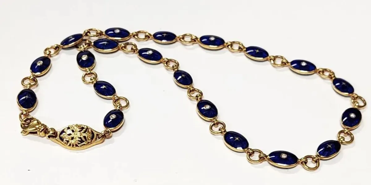 Faberge 18k Gold Diamond Cobalt Blue Enamel Link 16.5 inch Necklace. Image © Hess Fine Auctions (detail)