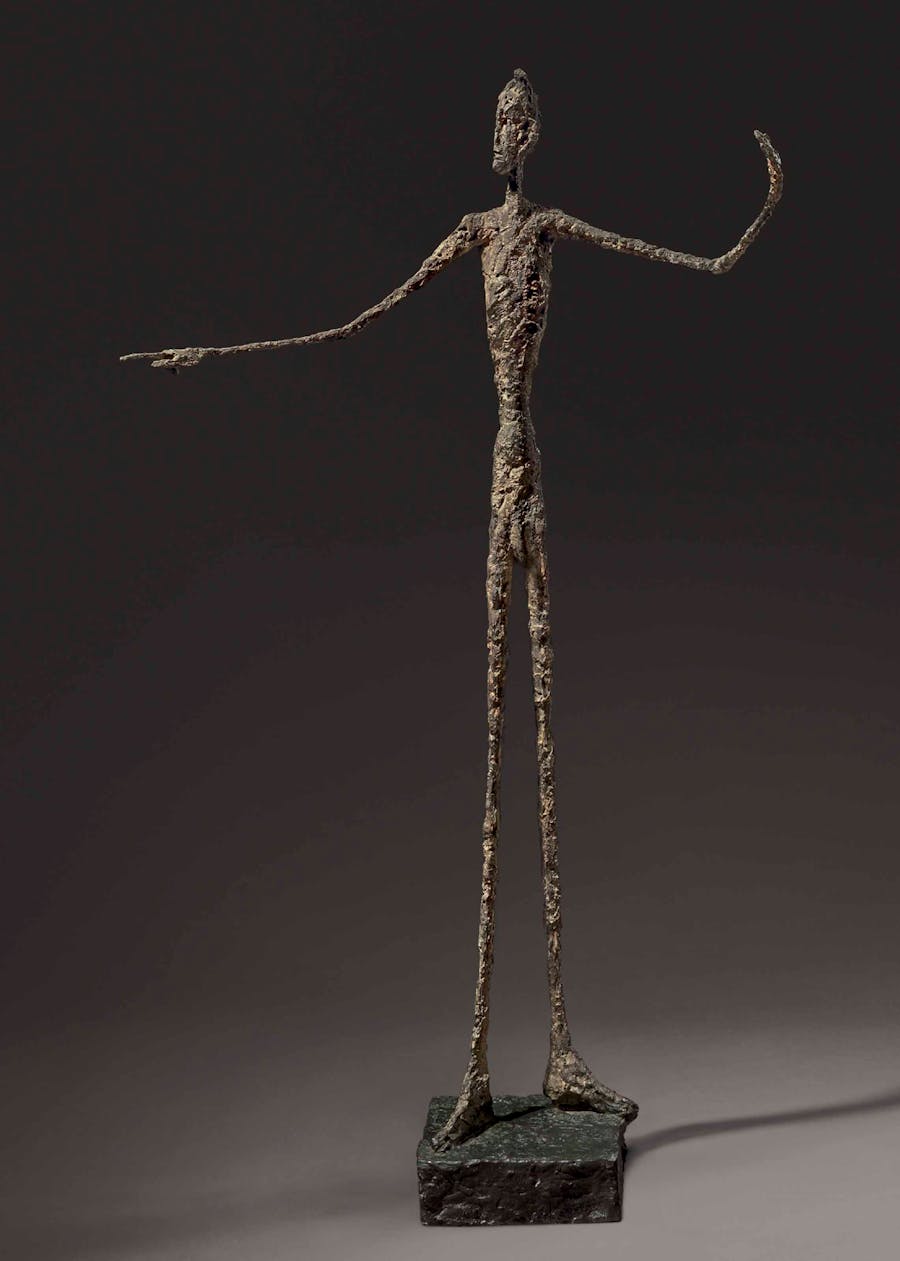 Alberto Giacometti (1901-1966), L'homme au doigt, 1947, bronze with patina, 177.5 cm. Image via Christie’s.