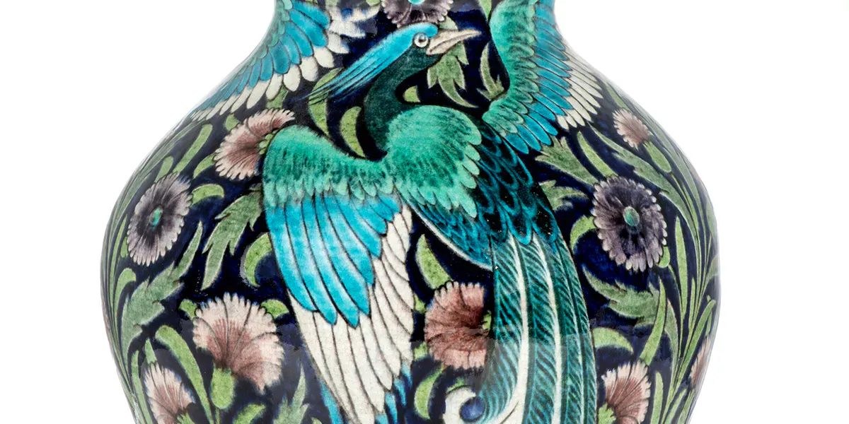 Large William De Morgan vase, circa 1890, decorated by Fred Passenger with three Persian style peacocks and manganese carnations on a dark blue background, 38.8 cm high. Photo © Christie's
