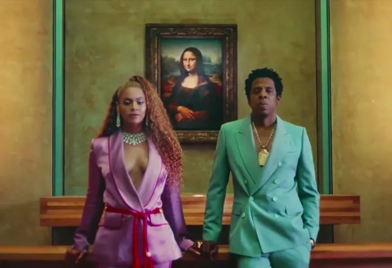 Still from “Apeshit” – the couple posing in front of the Mona Lisa in 2018. Photo via: NY Times.