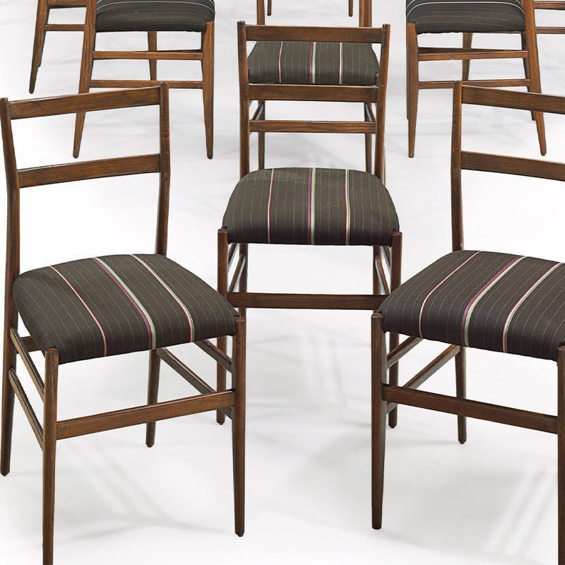 Gio Ponti (1871-1979), 'Superleggera; chairs made of walnut, designed in 1955, manufactured by Cassina, covers by Paul Smith, height 83 cm each. Photo © Christie's