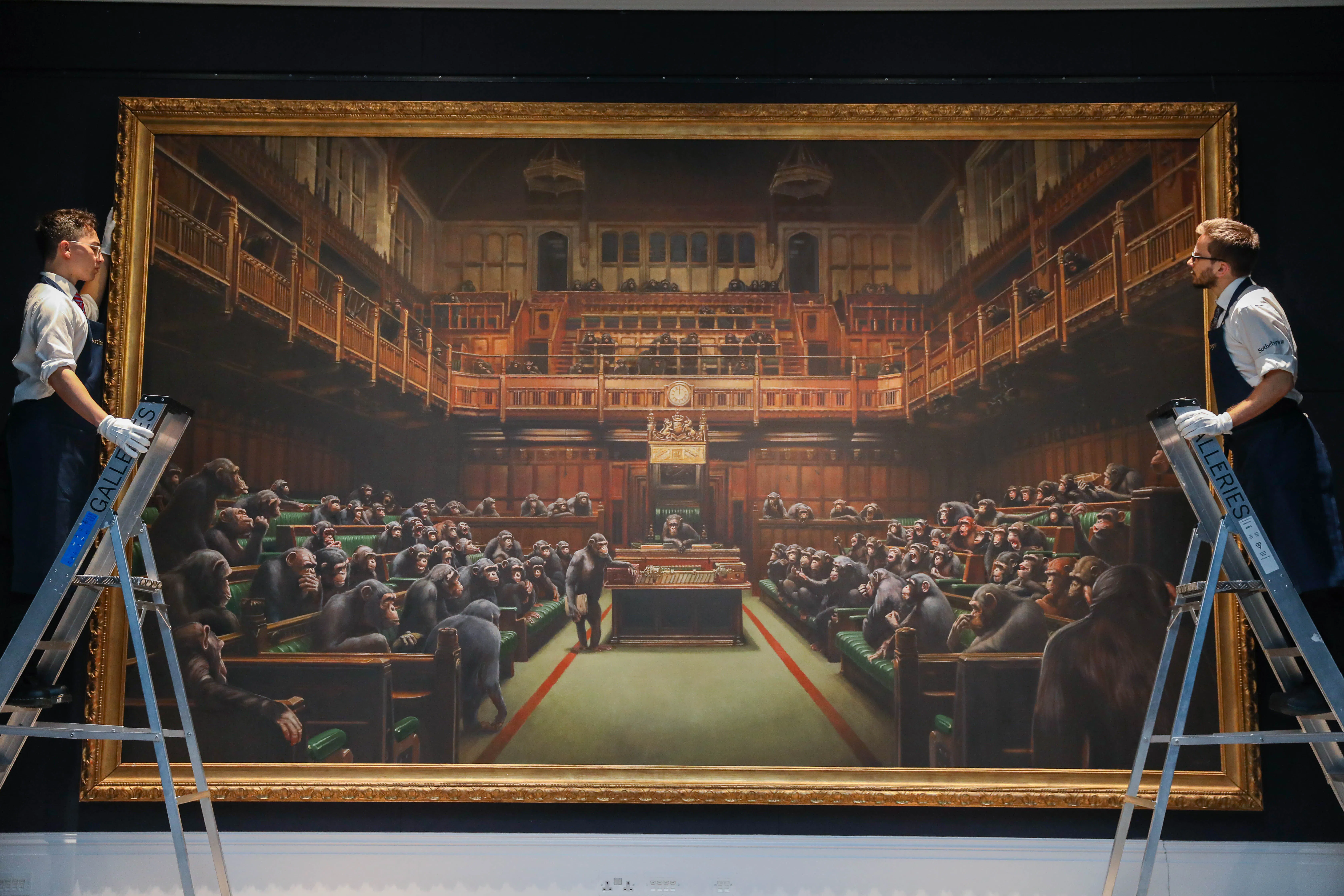 Banksy's Devolved Parliament (est. GBP1.5-2m) was displayed to the press during the preview for Sotheby’s Frieze Week Contemporary Art Auctions at Sotheby's. Banksy's Devolved Parliament was offered in Sotheby’s Frieze Week Contemporary Art Evening Auction alongside works by Basquiat, Fontana, Borgeois, Hackney, Bacon and more. Photo by Tristan Fewings/Getty Images for Sotheby's