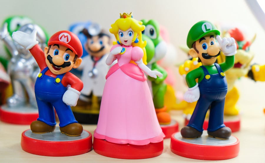 Toys of characters Mario, Luigi, and Peach [cropped]. Photo: @ryanquintal via Unsplash