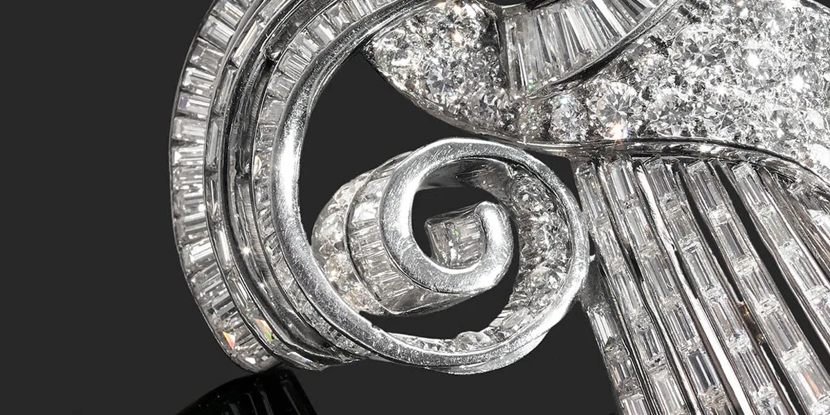 Pair of diamond scroll clips [detail], French work, 1930s, image © Tajan