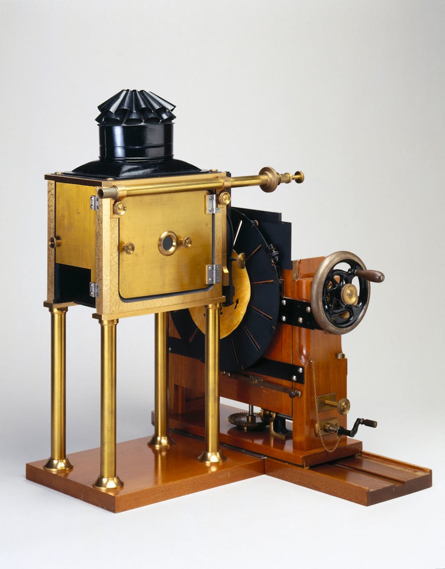 Muybridges Zoopraxiscope, 1880. UNITED KINGDOM - OCTOBER 27: Replica. Eadweard Muybridge (1830-1904) designed the Zoopraxiscope in 1879 to project upon a screen a cycle of natural human and animal movements from a series of still photographs. Based on the principle of the Phenakistoscope, the Zoopraxiscope had a counter-rotating shutter which briefly flashed each image onto the screen as the disc rotated. Muybridge was the first photographer to carry out the analysis of movement by sequence photography, an important stage in the invention of cinematography. (Photo by SSPL/Getty Images)