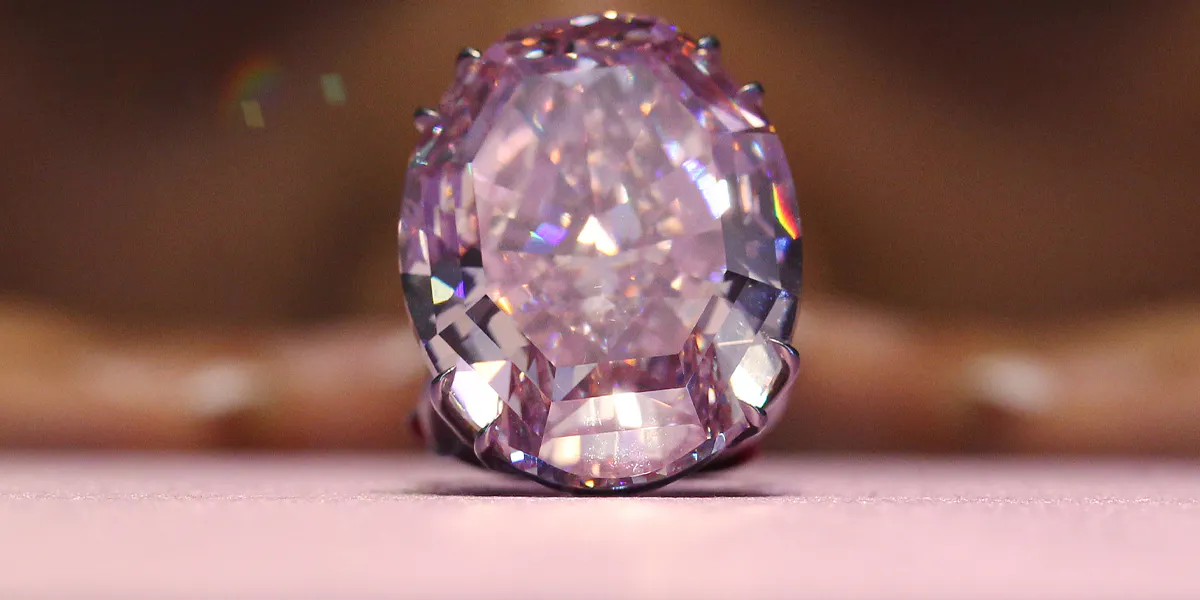 The Pink Star Diamond weighing 59.6 carats is displayed during a press preview at Sotheby's in Wan Chai. 03OCT13 (Photo by Felix Wong/South China Morning Post via Getty Images)