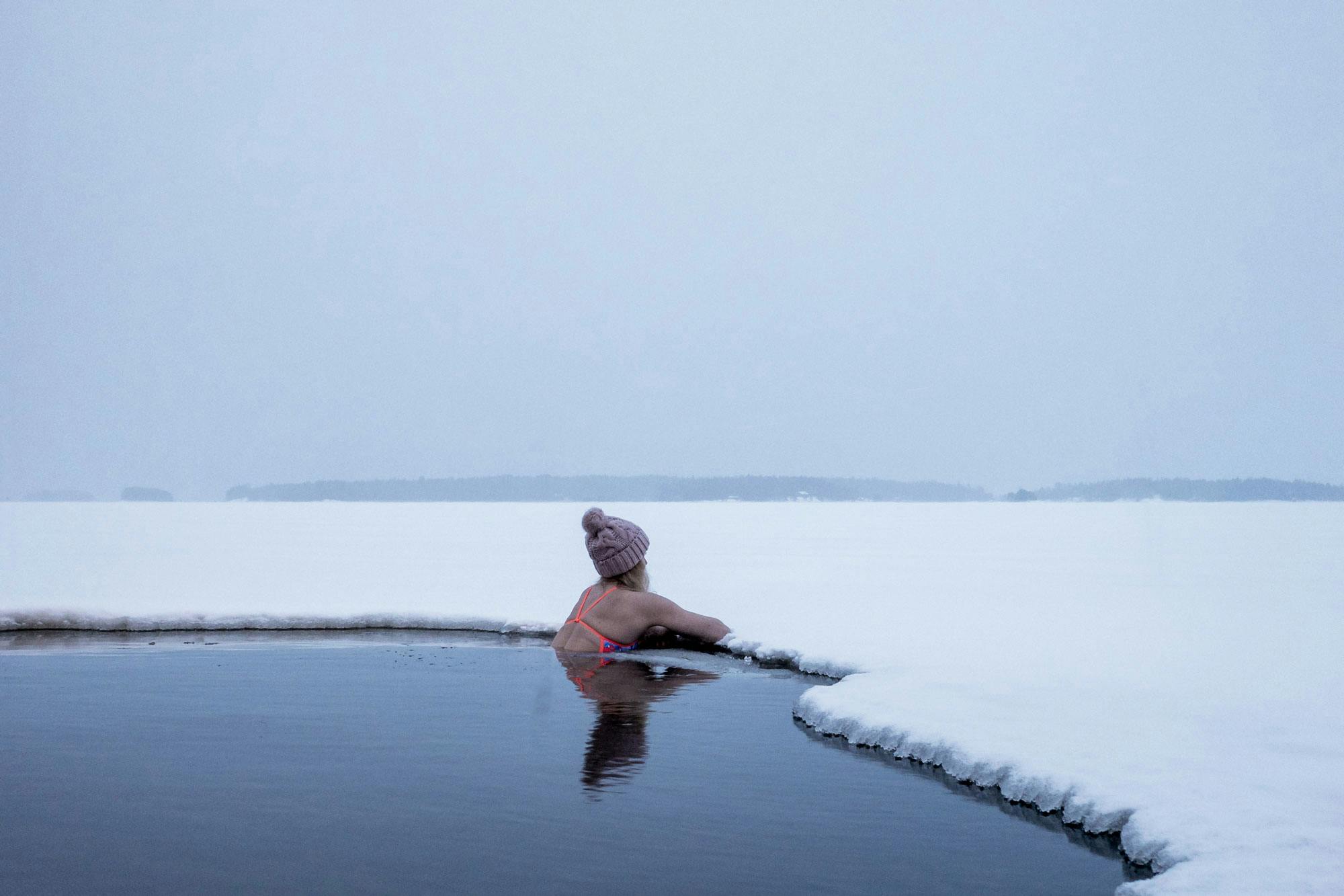 A woman swimming in winter