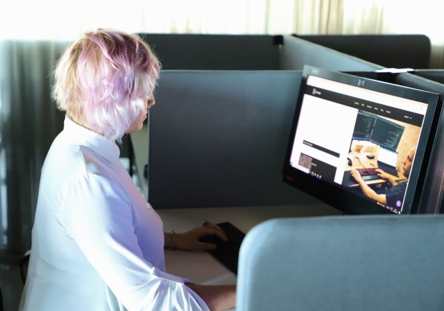 A woman reading a blog on her computer