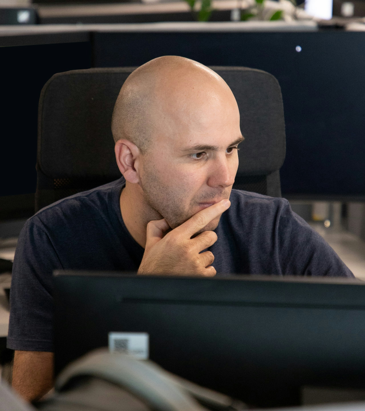 Man looking pensively into the computer screen Man looking pensively into the computer screen