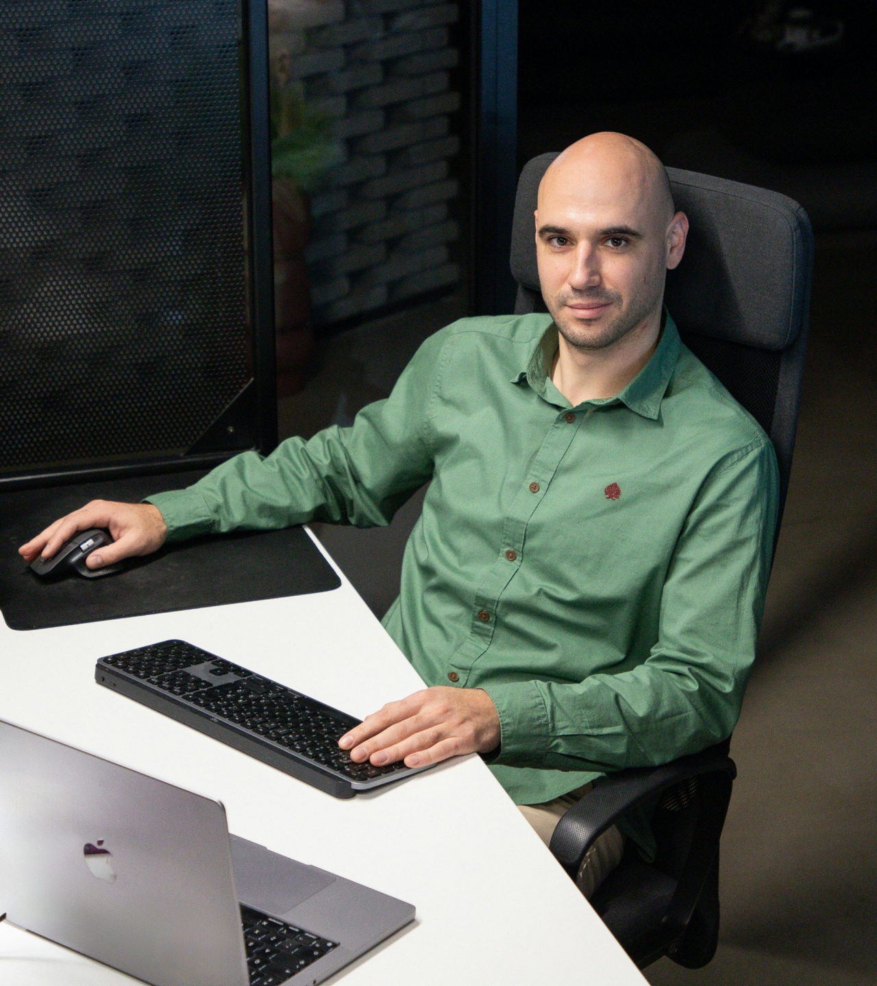 man sitting in front of a laptop