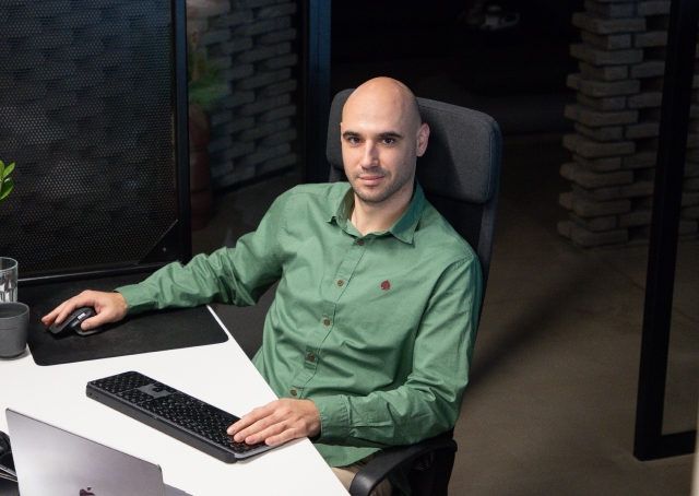 man sitting in front of a laptop