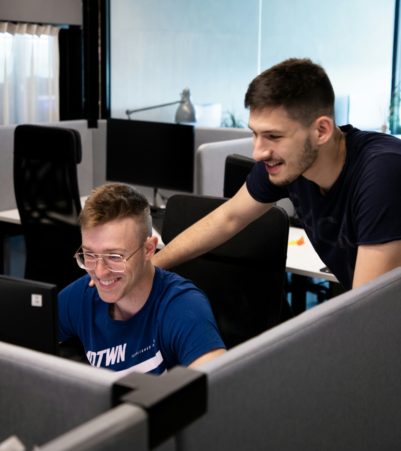 Two coworkers smiling