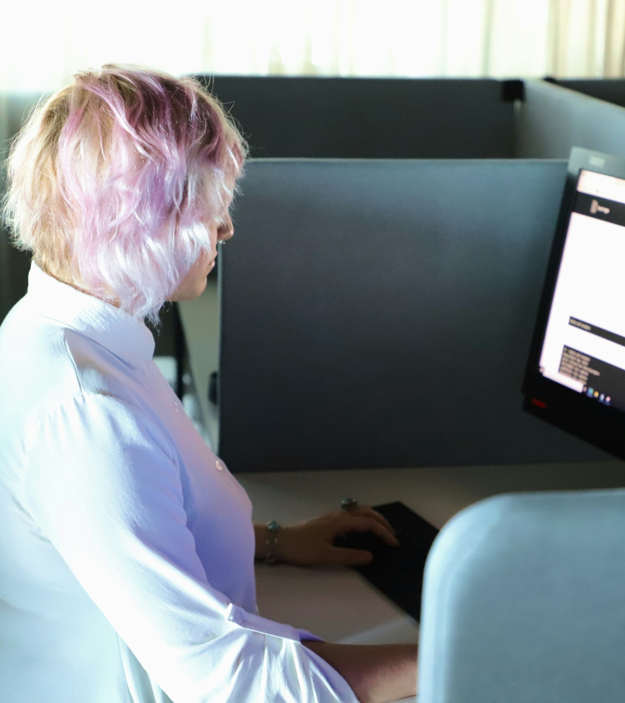 A woman reading a blog on her computer