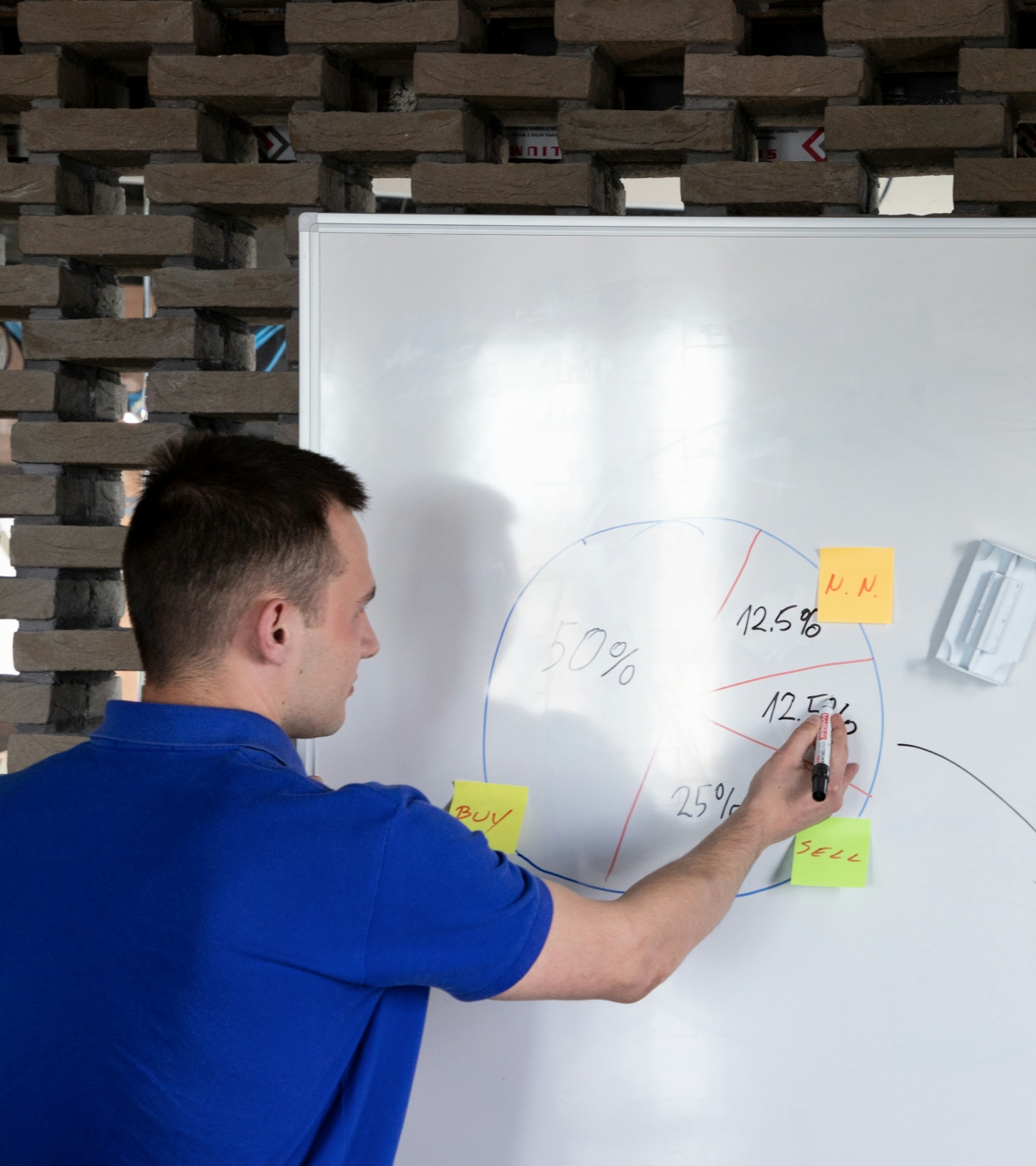 Man drawing a pie chart 