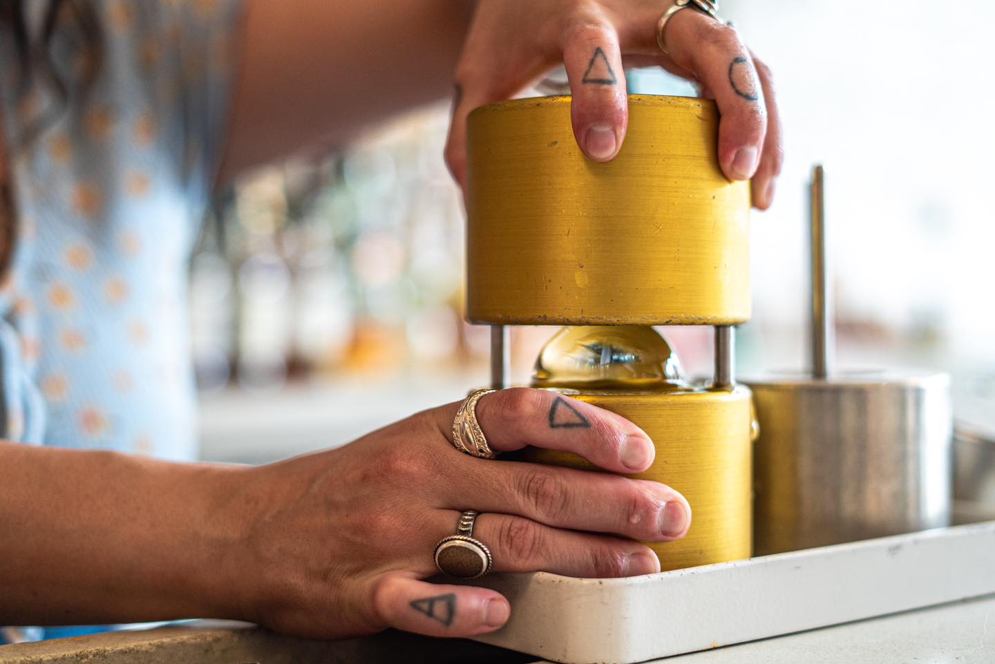A bartender at The Public House in Bay City making a drink called "Moon Over Mexico"