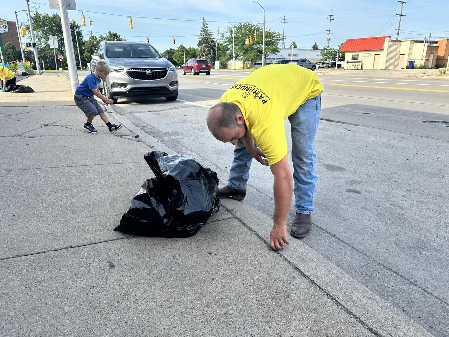 Picking up trash and pulling weeds in Bay City