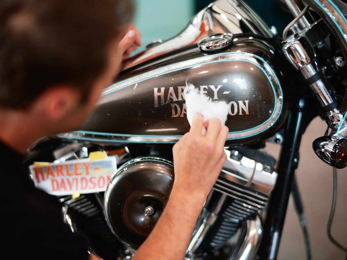 Justin Stilson, owner of Stilson Sign and Custom painting a motorcycle