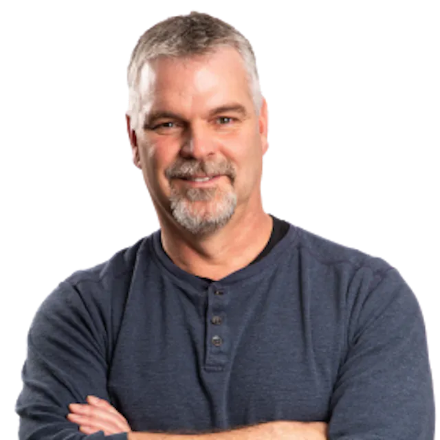 Photo of Bernie McClean with his arms crossed