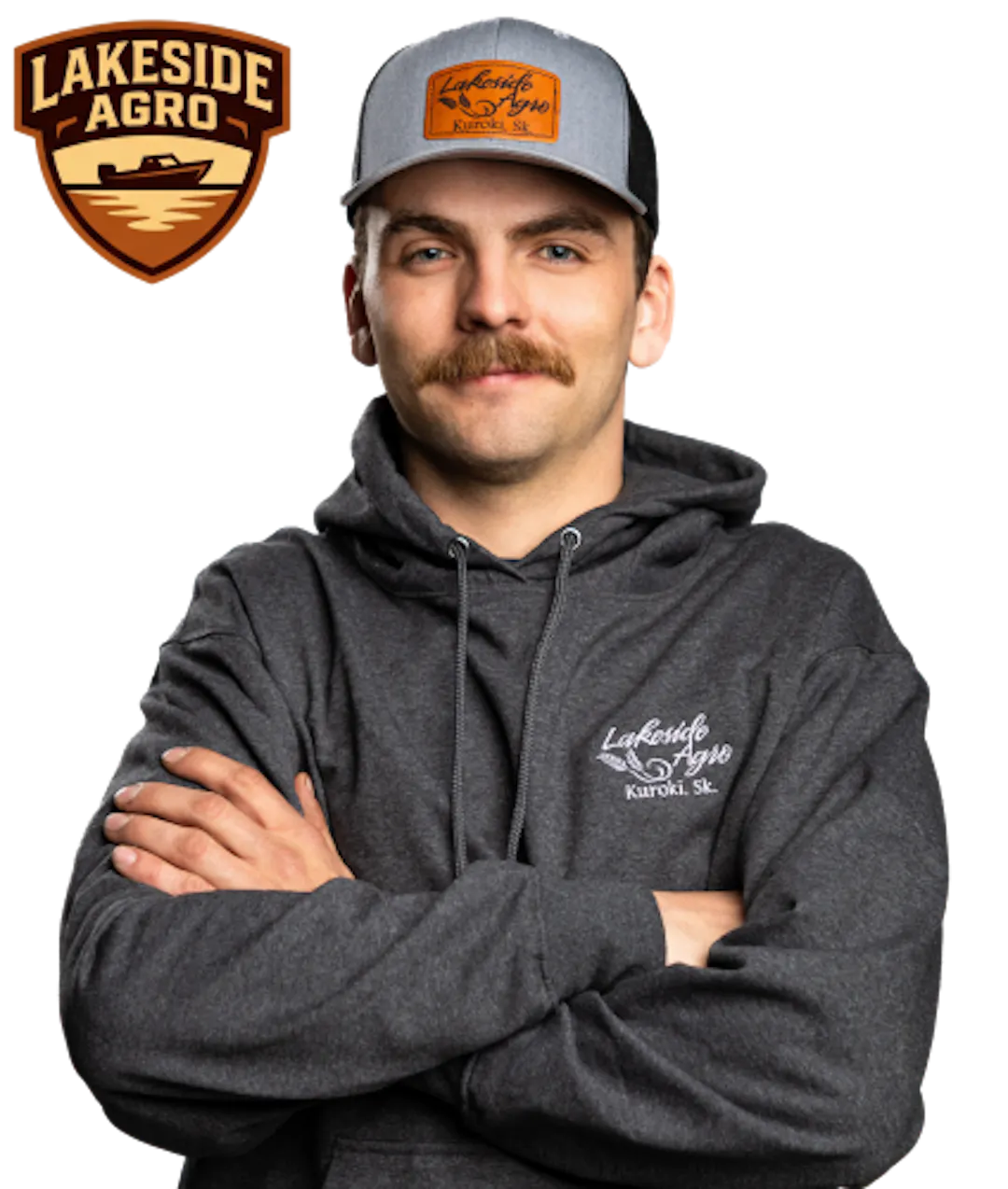 Shield badge showing a lake with shoreline and horizon lines, labeled “Lakeside Agro” in brown and tan beside a photo of Jay Bindig with his arms crossed