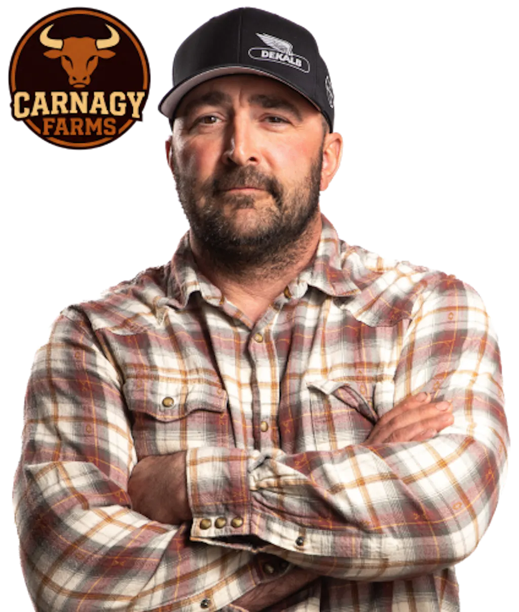 Circular badge featuring a bull head silhouette with the text “Carnagy Farms,” styled in brown and burnt orange beside a photo of Clint Nagy with his arms crossed