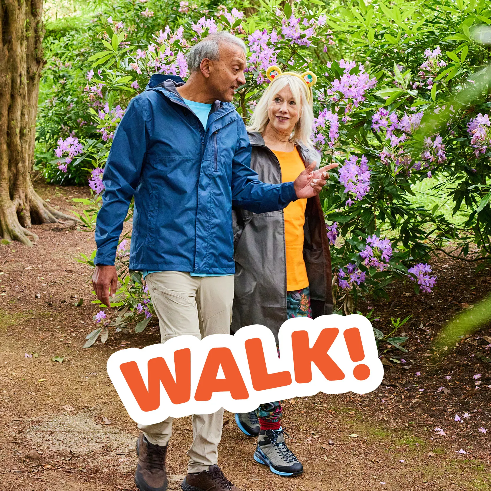 Two adults walking in the park. 