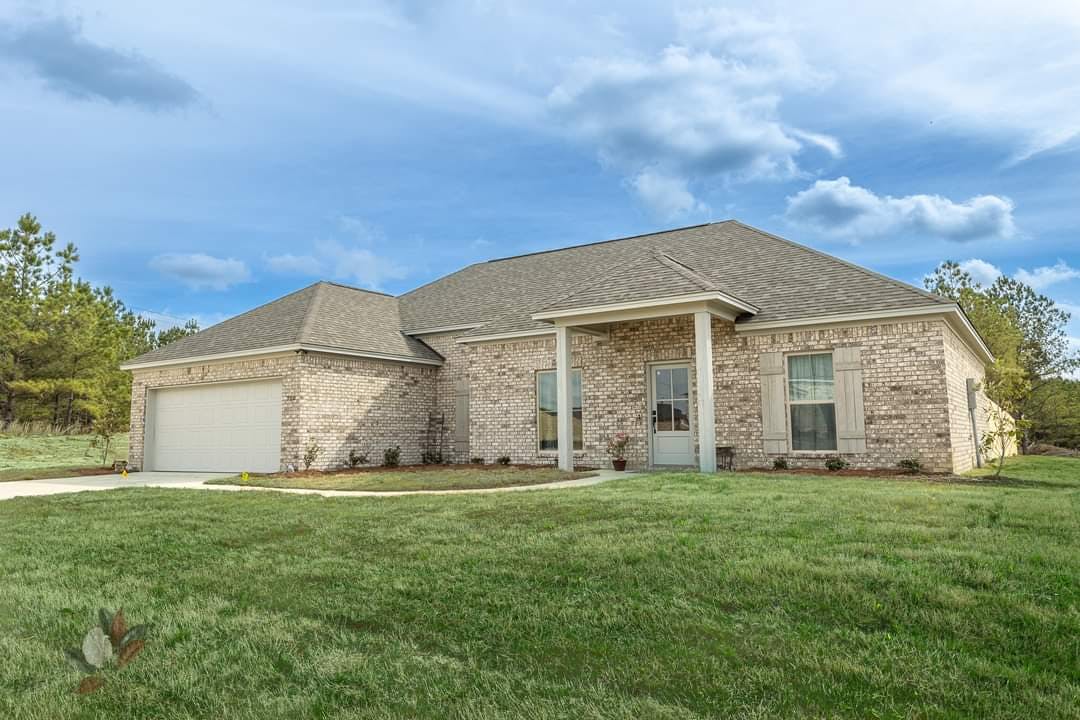 Brick single family home exterior with attached garage