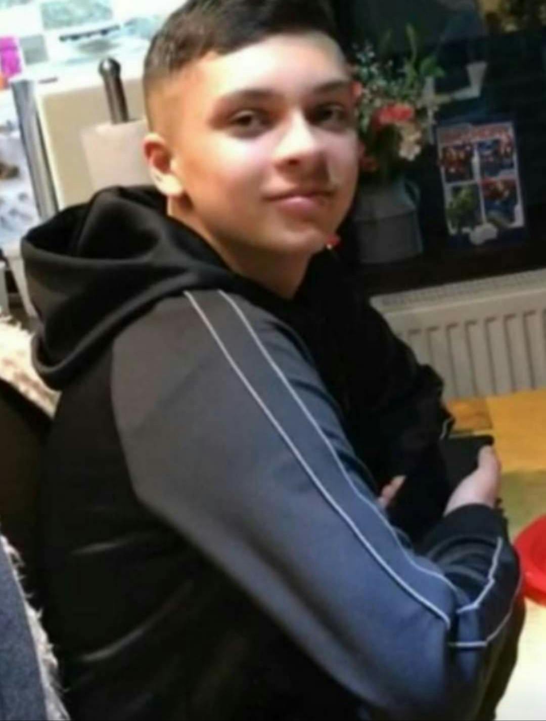 Brandon sat looking at camera