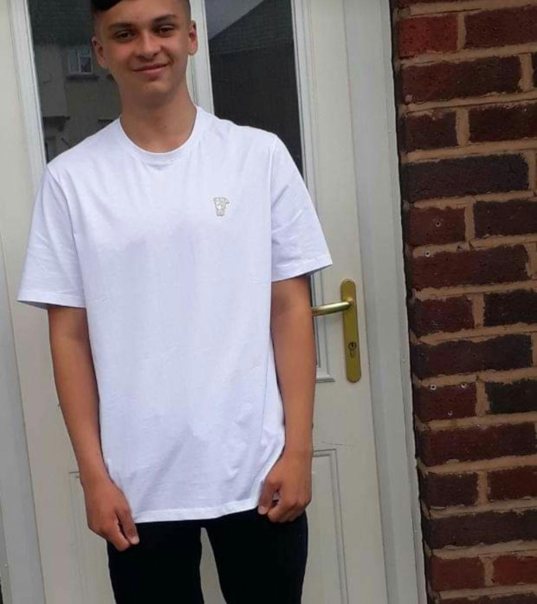 Brandon stood smiling at camera