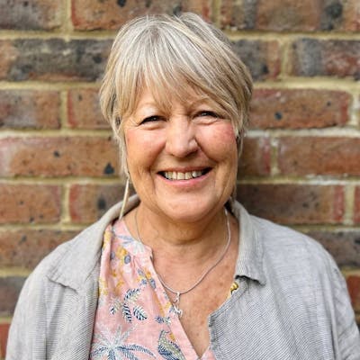 Jo smiling in a profile photo.