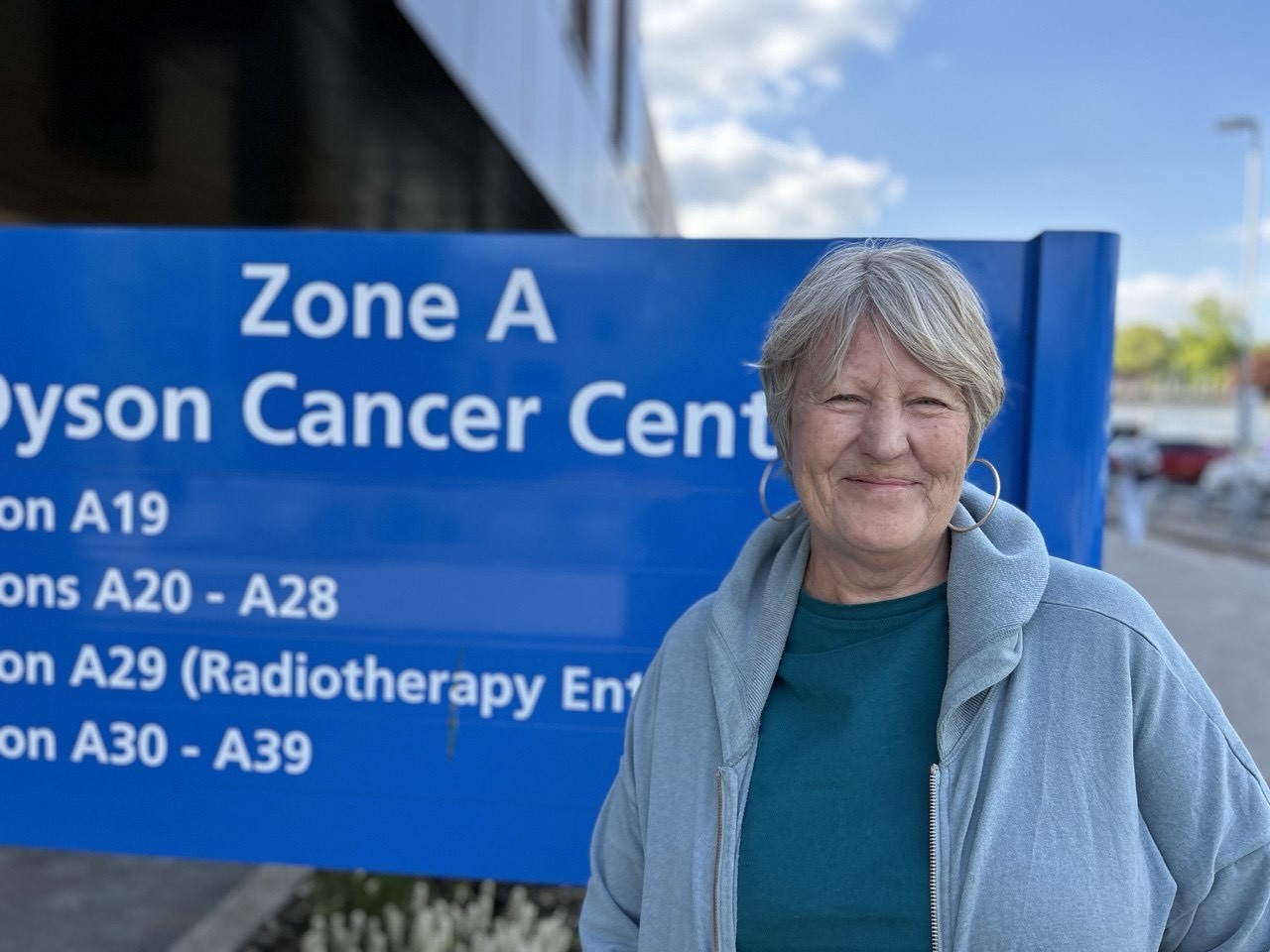 Jo smiling outside the cancer ward.