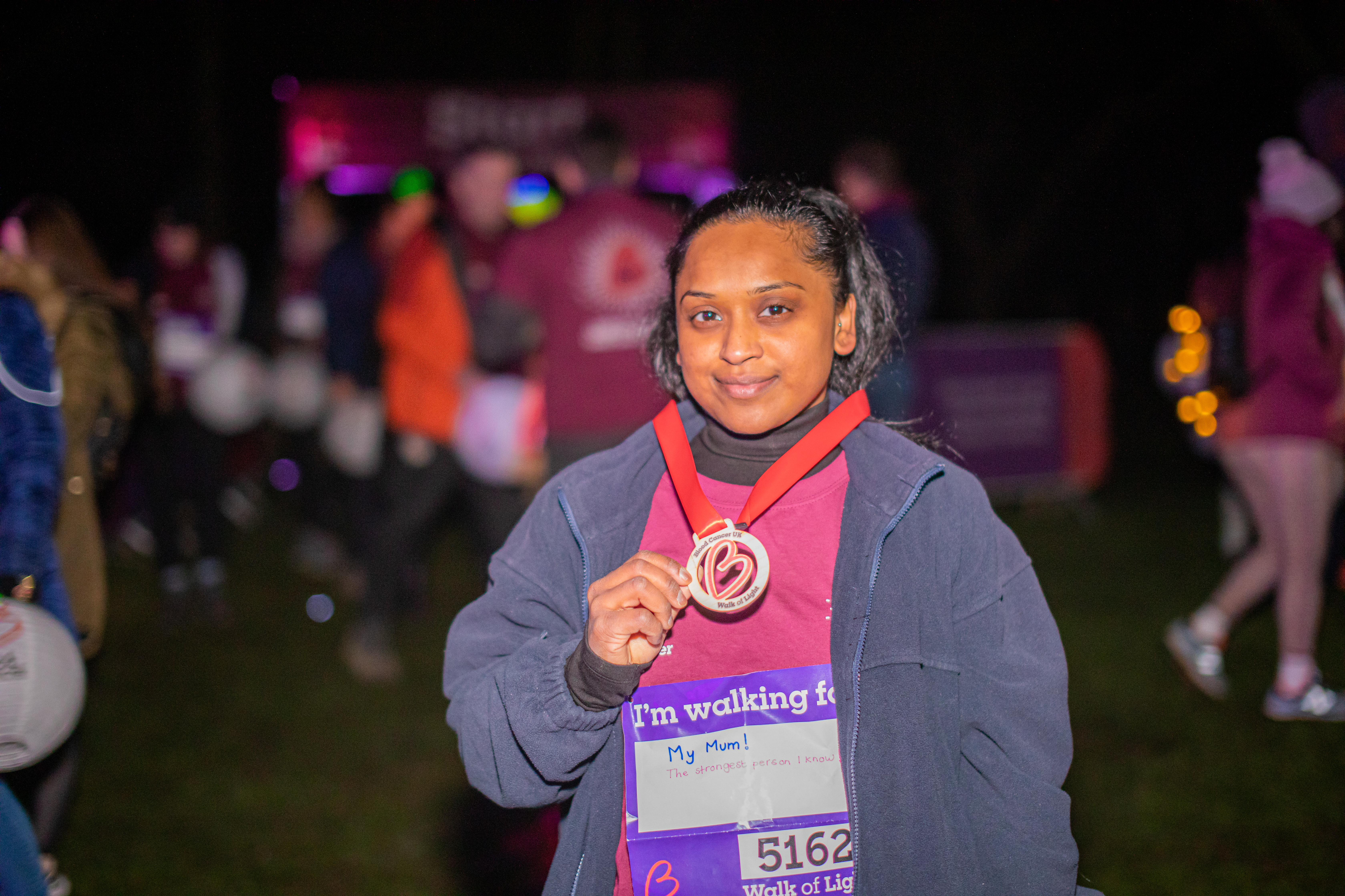 BCUK supporter holding a medal.