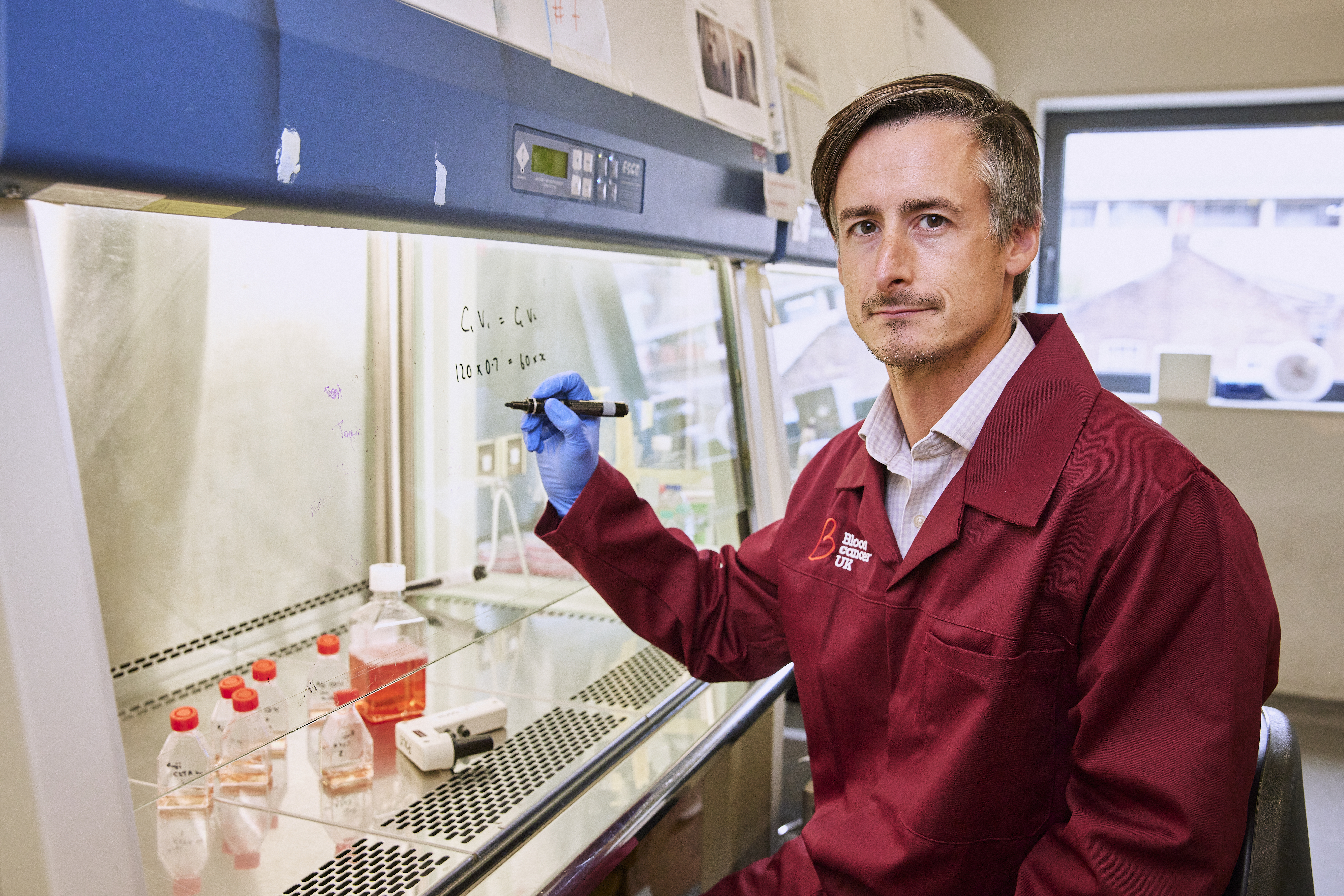 Researcher wearing BCUK lab coat. 