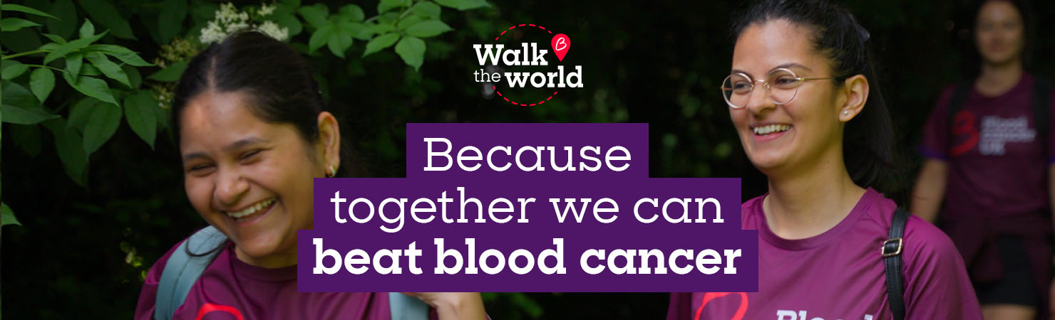 Two people smiling in Blood Cancer UK t-shirts with text overlaid, Because together we can beat blood cancer.